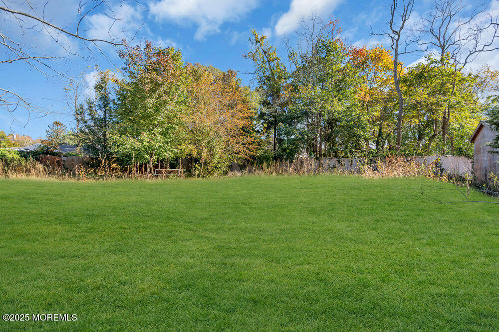 22 Lacey Road Forked River, NJ 08731 - Photo 19 of 24 a garden with trees in front of it