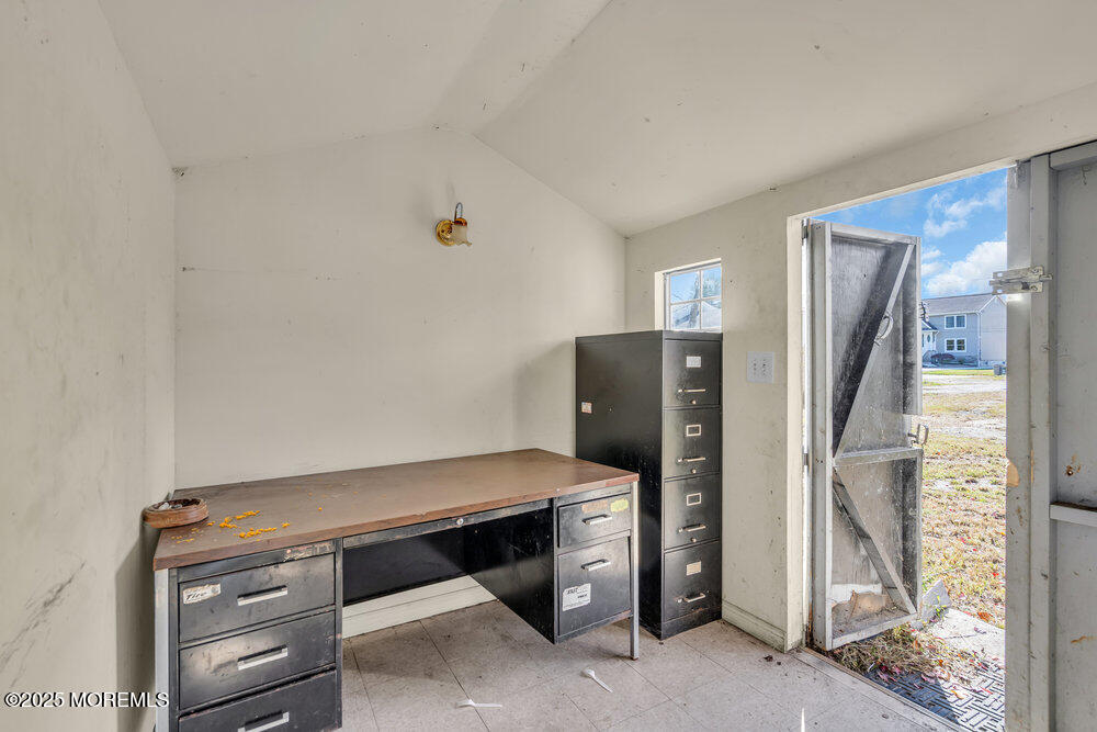 22 Lacey Road Forked River, NJ 08731 - Photo 20 of 24 a room with a closet and mirror