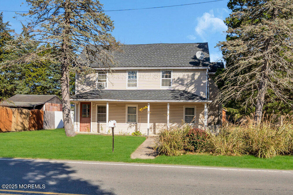 22 Lacey Road Forked River, NJ 08731 - Photo 22 of 24 a front view of house with yard and green space