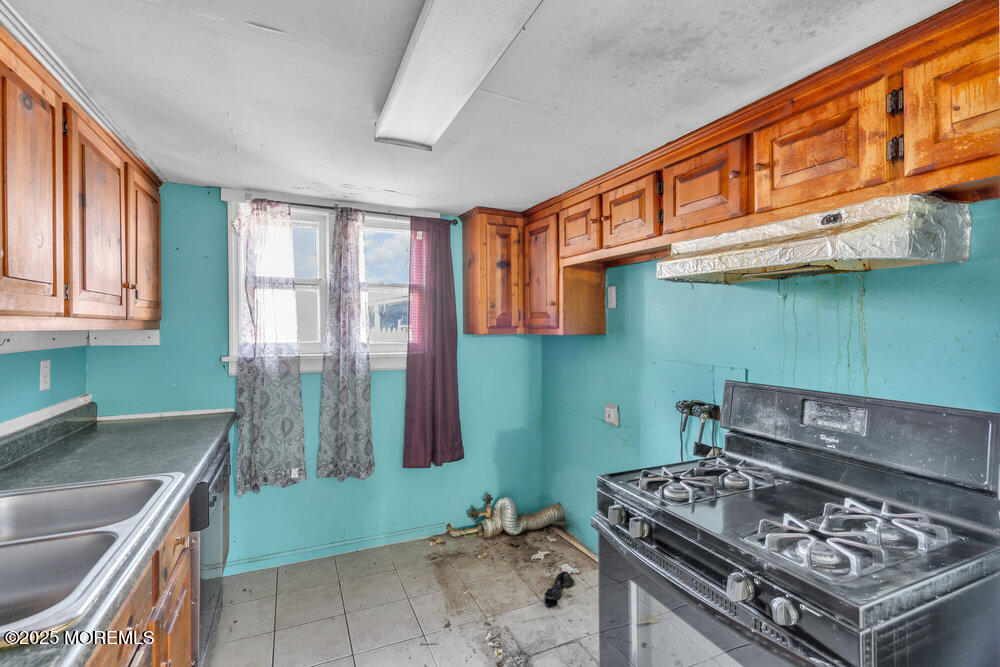 22 Lacey Road Forked River, NJ 08731 - Photo 6 of 24 a kitchen with a stove and a sink