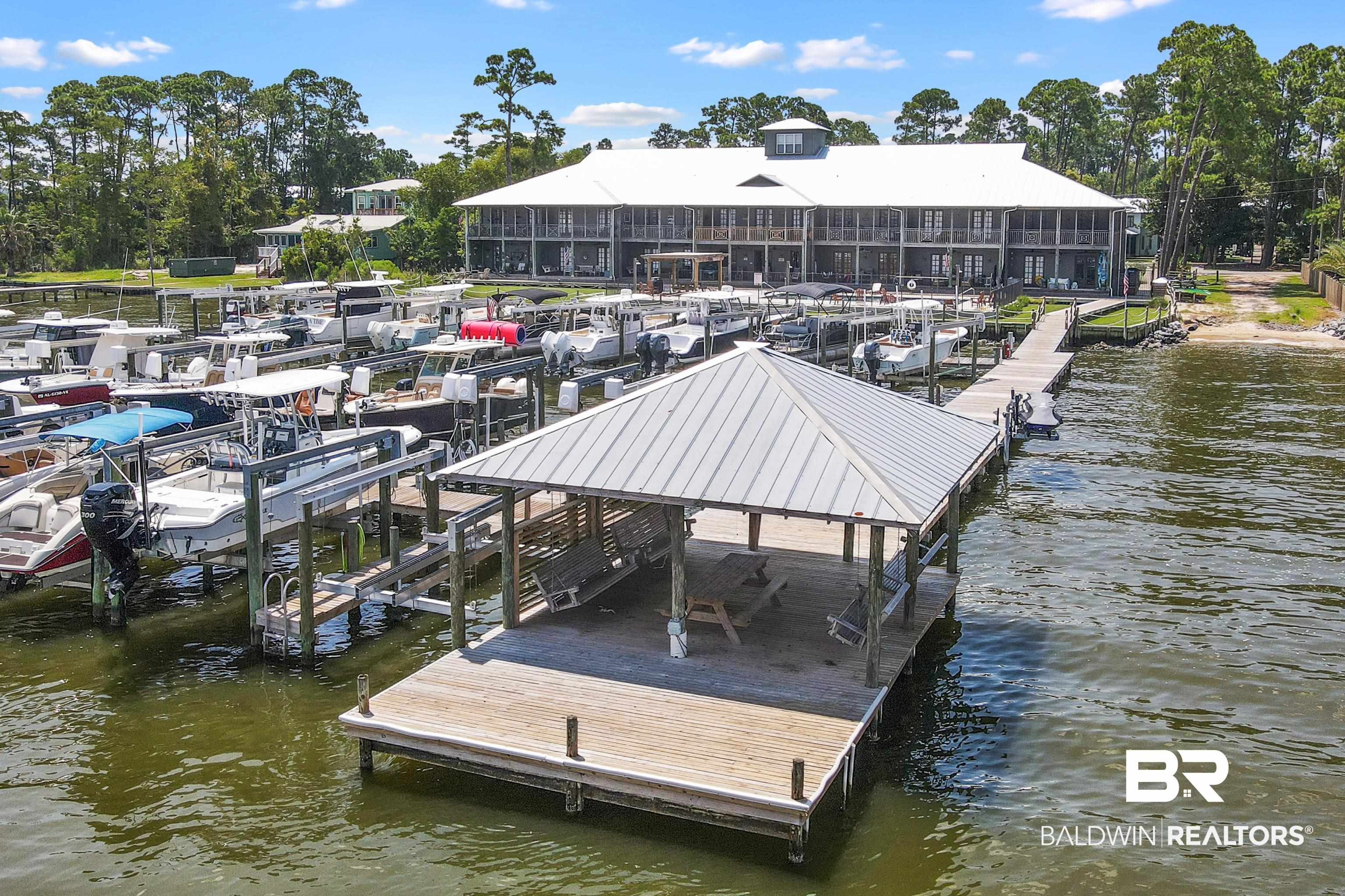 25773 Canal Road, Unit 10 Orange Beach, AL 36561 - Photo 32 of 40 View of dock with benches