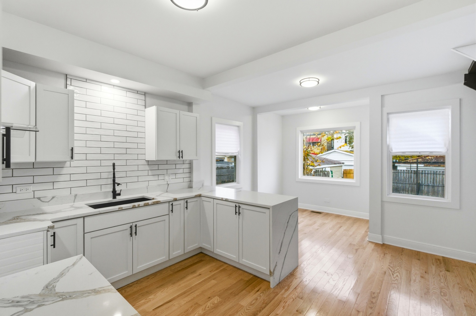 8327 South Morgan Street Chicago, IL 60620 - Photo 19 of 46 a kitchen with a sink and cabinets