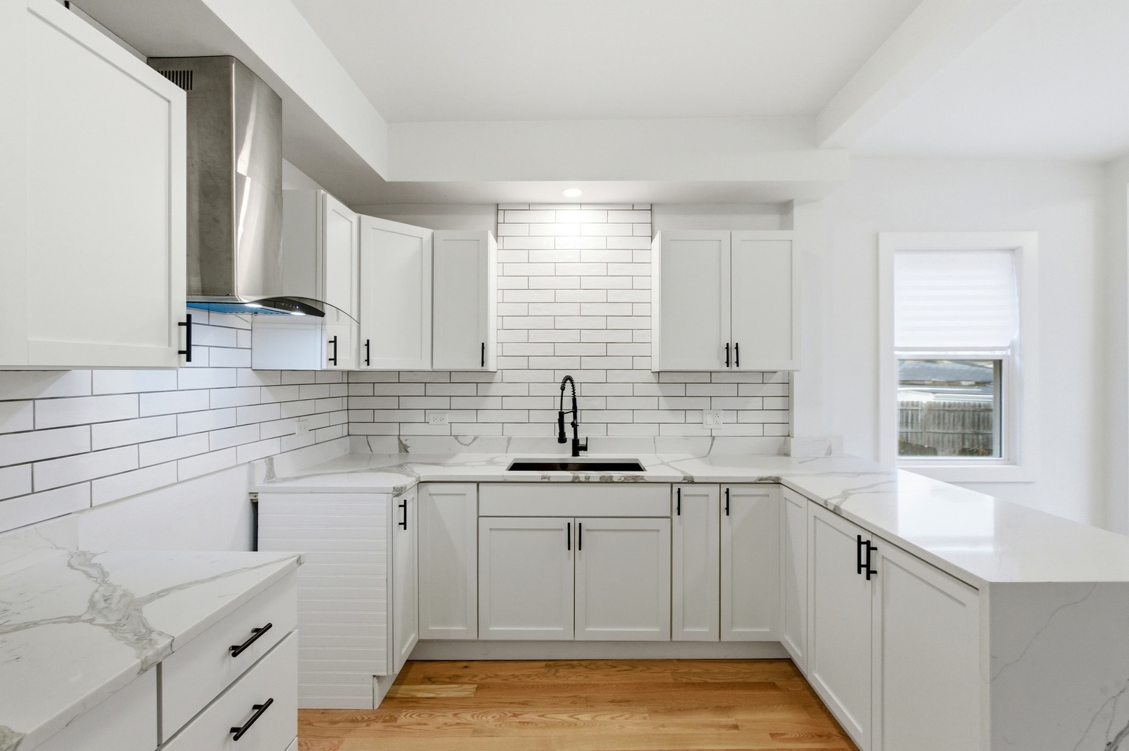 8327 South Morgan Street Chicago, IL 60620 - Photo 20 of 46 a kitchen with white cabinets sink and dishwasher