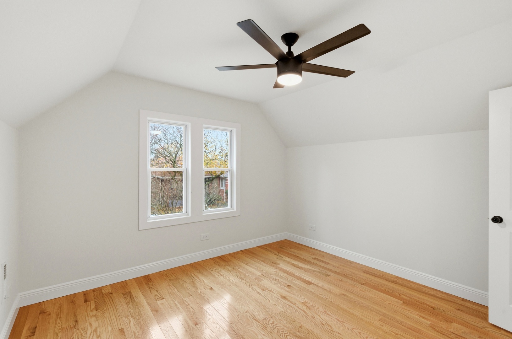 8327 South Morgan Street Chicago, IL 60620 - Photo 25 of 46 an empty room with wooden floor and windows