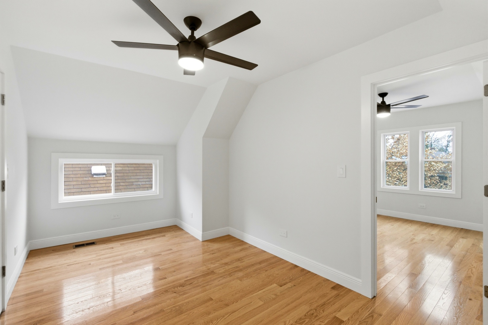 8327 South Morgan Street Chicago, IL 60620 - Photo 28 of 46 a view of an empty room with wooden floor and a window