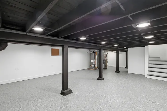 a view of an empty room with a fireplace