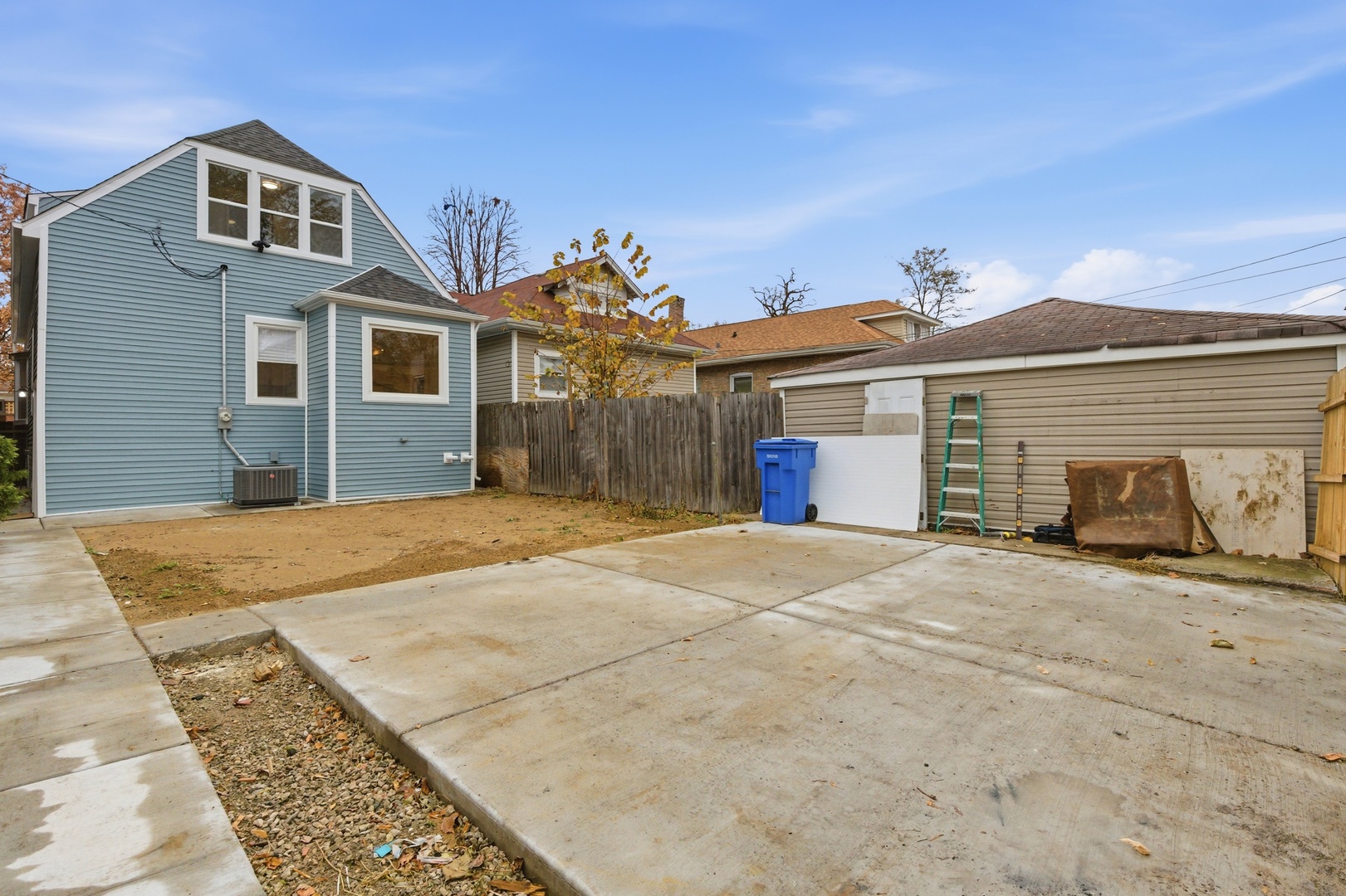 8327 South Morgan Street Chicago, IL 60620 - Photo 33 of 42 a front view of a house with a yard and garage