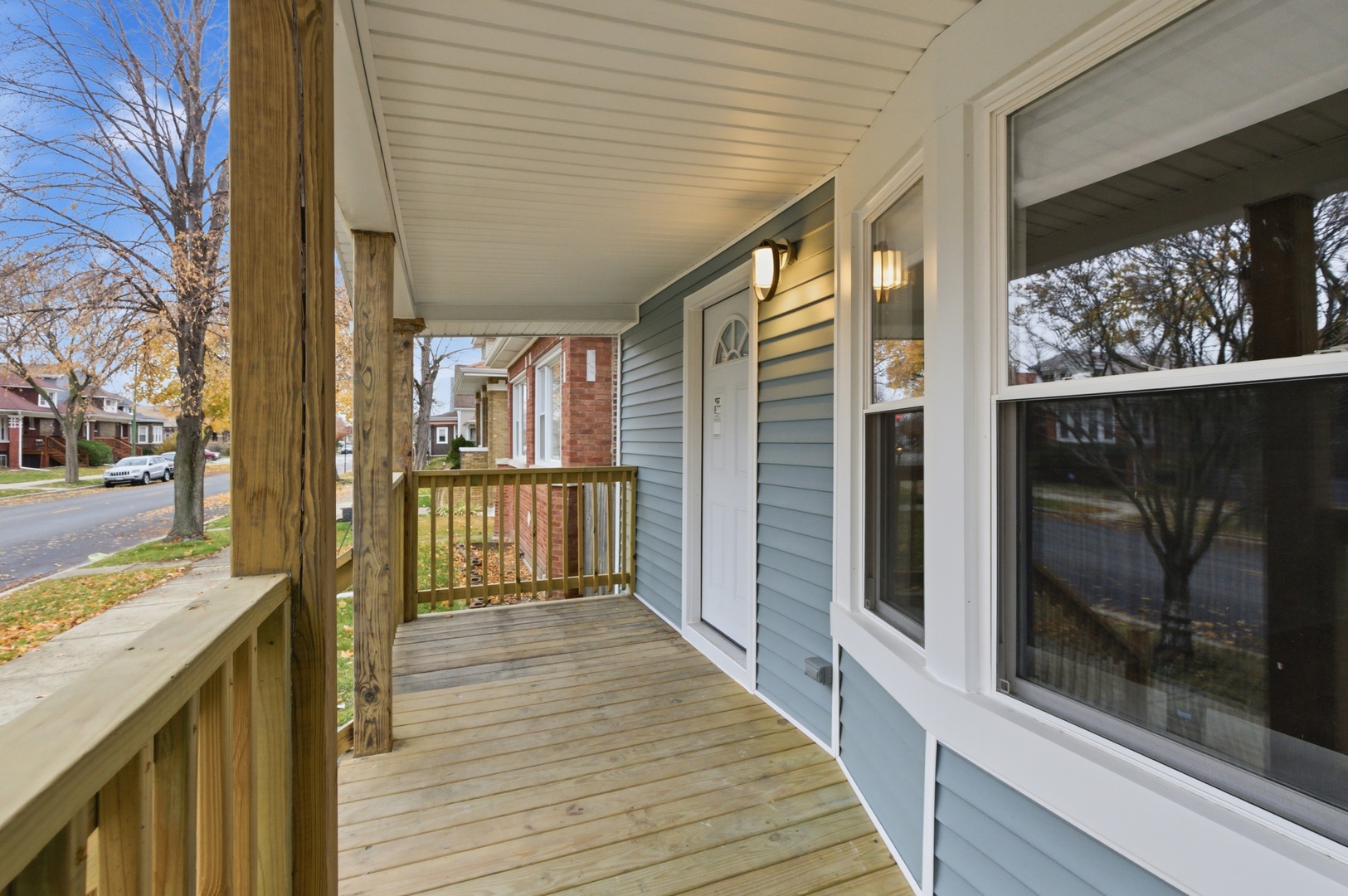 8327 South Morgan Street Chicago, IL 60620 - Photo 5 of 46 a view of a balcony with wooden floor and iron stairs