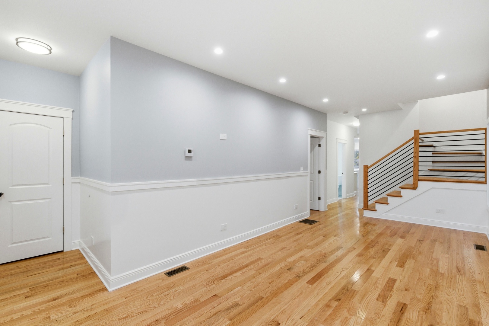 8327 South Morgan Street Chicago, IL 60620 - Photo 7 of 46 a view of an empty room with wooden floor