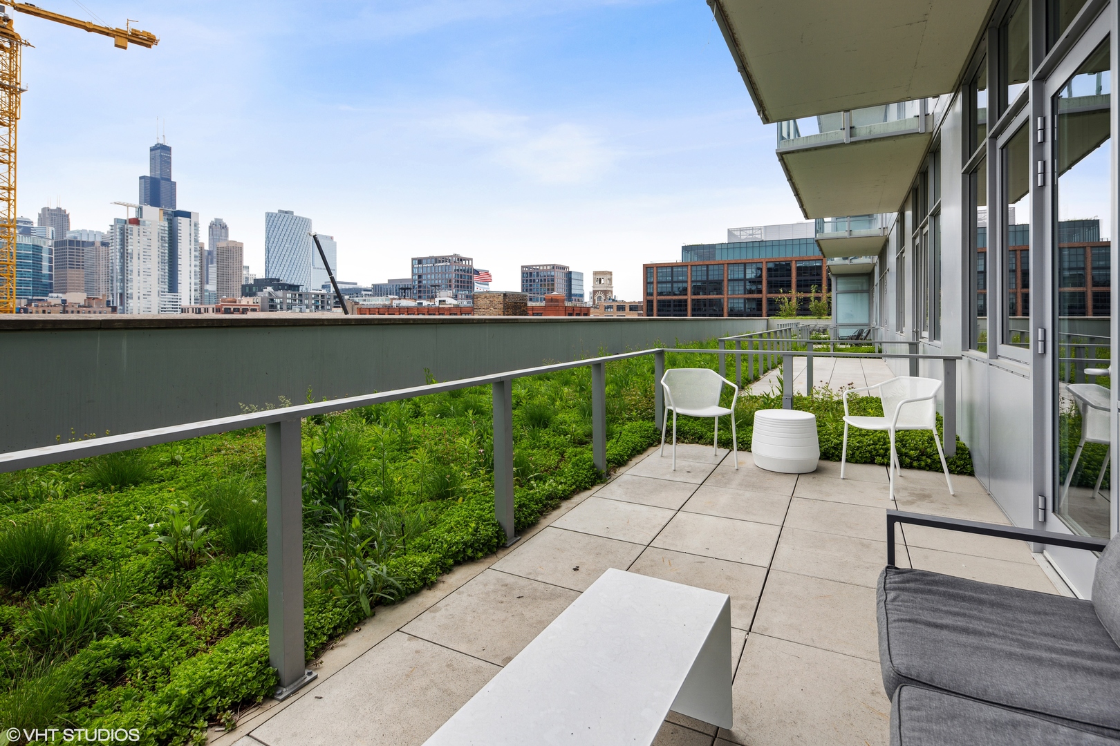 171 North Aberdeen Street, Unit 607 Chicago, IL 60607 - Photo 11 of 20 a view of a city from a balcony