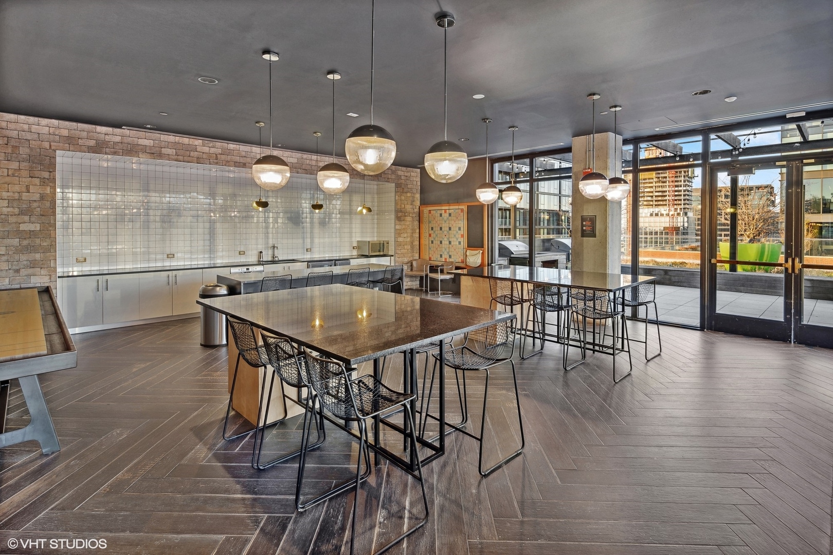 171 North Aberdeen Street, Unit 607 Chicago, IL 60607 - Photo 14 of 20 an open kitchen with a table and chairs in it