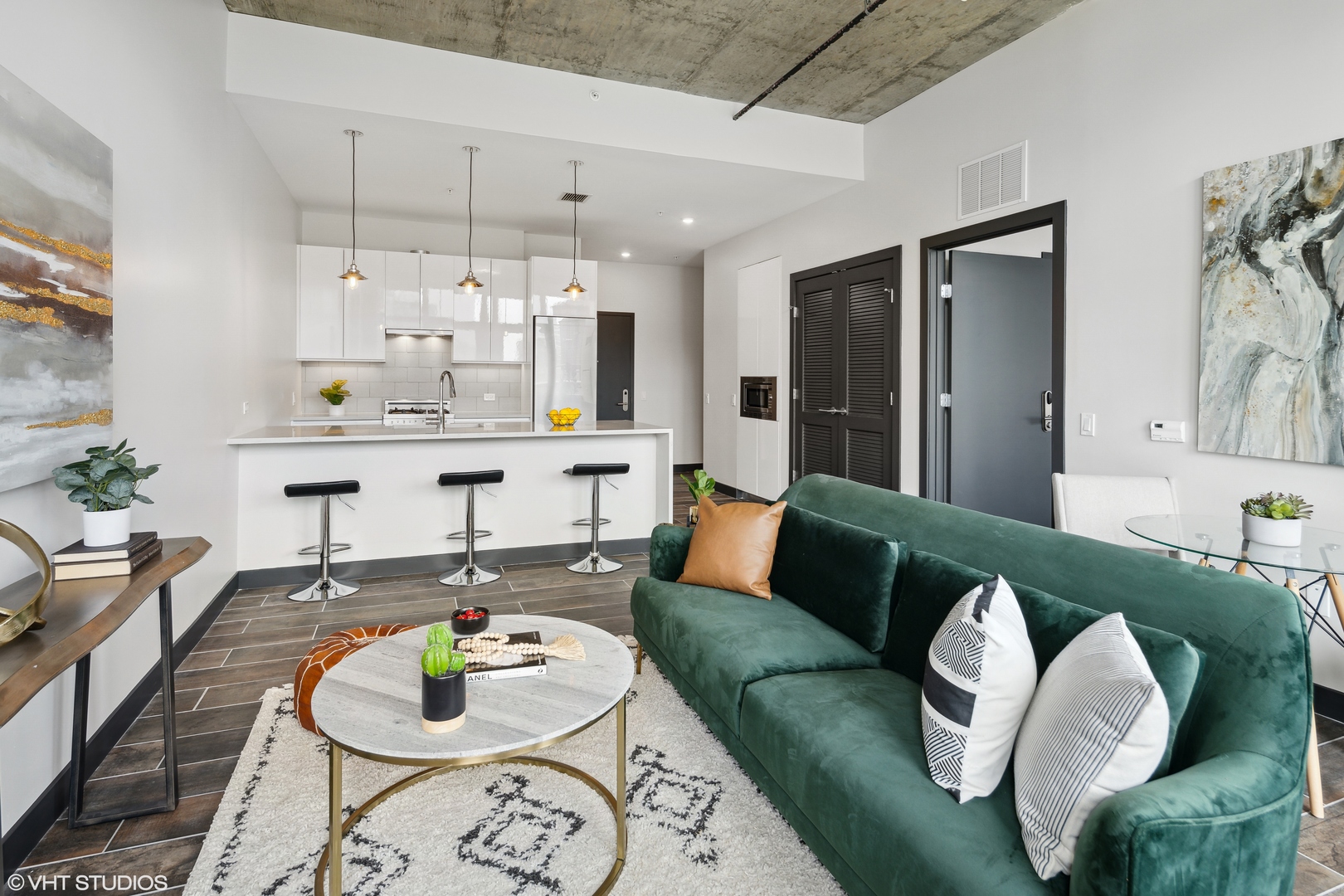 171 North Aberdeen Street, Unit 607 Chicago, IL 60607 - Photo 2 of 20 a living room with furniture and kitchen view