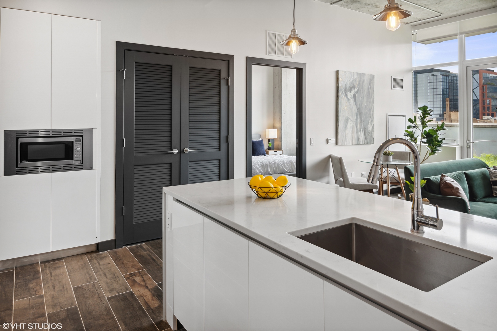 171 North Aberdeen Street, Unit 607 Chicago, IL 60607 - Photo 5 of 20 a kitchen with a sink and a refrigerator