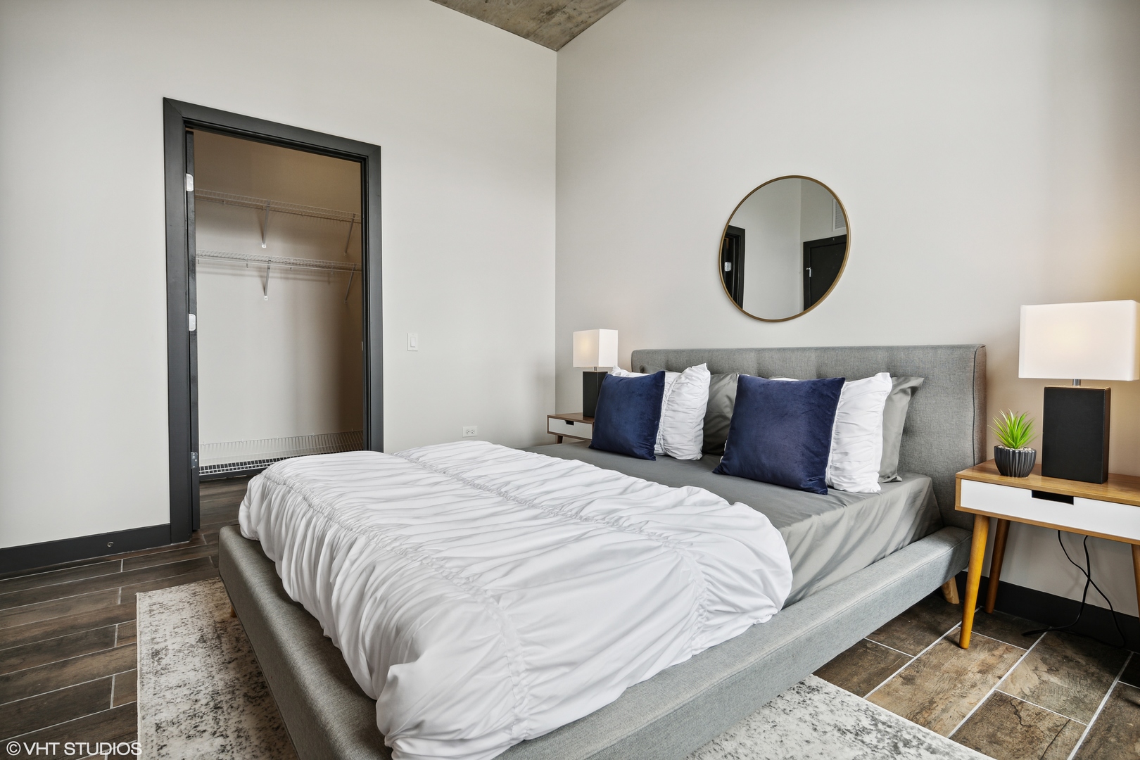171 North Aberdeen Street, Unit 607 Chicago, IL 60607 - Photo 8 of 20 a bedroom with bed and a window