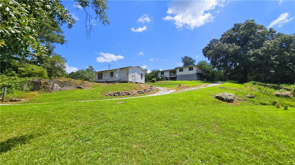 2011 Carr Road Northeast Conyers, GA 30012 - Photo 1 of 1 a view of a big yard with swimming pool