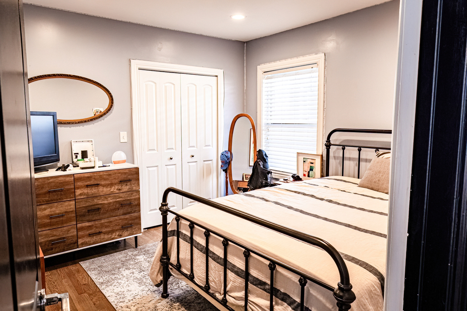 1911 Ridgeland Avenue Berwyn, IL 60402 - Photo 9 of 21 a bedroom with a bed a dresser and windows