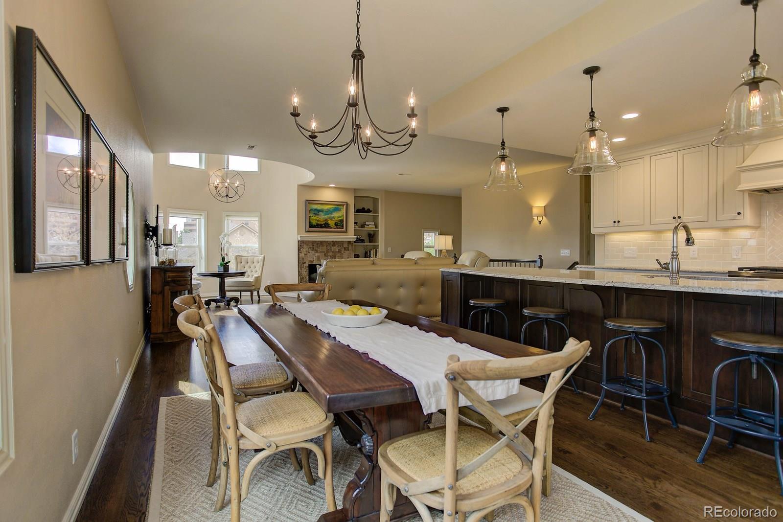 2 Garfield Street, Unit B Denver, CO 80206 - Photo 14 of 24 a view of a dining room with furniture and a chandelier