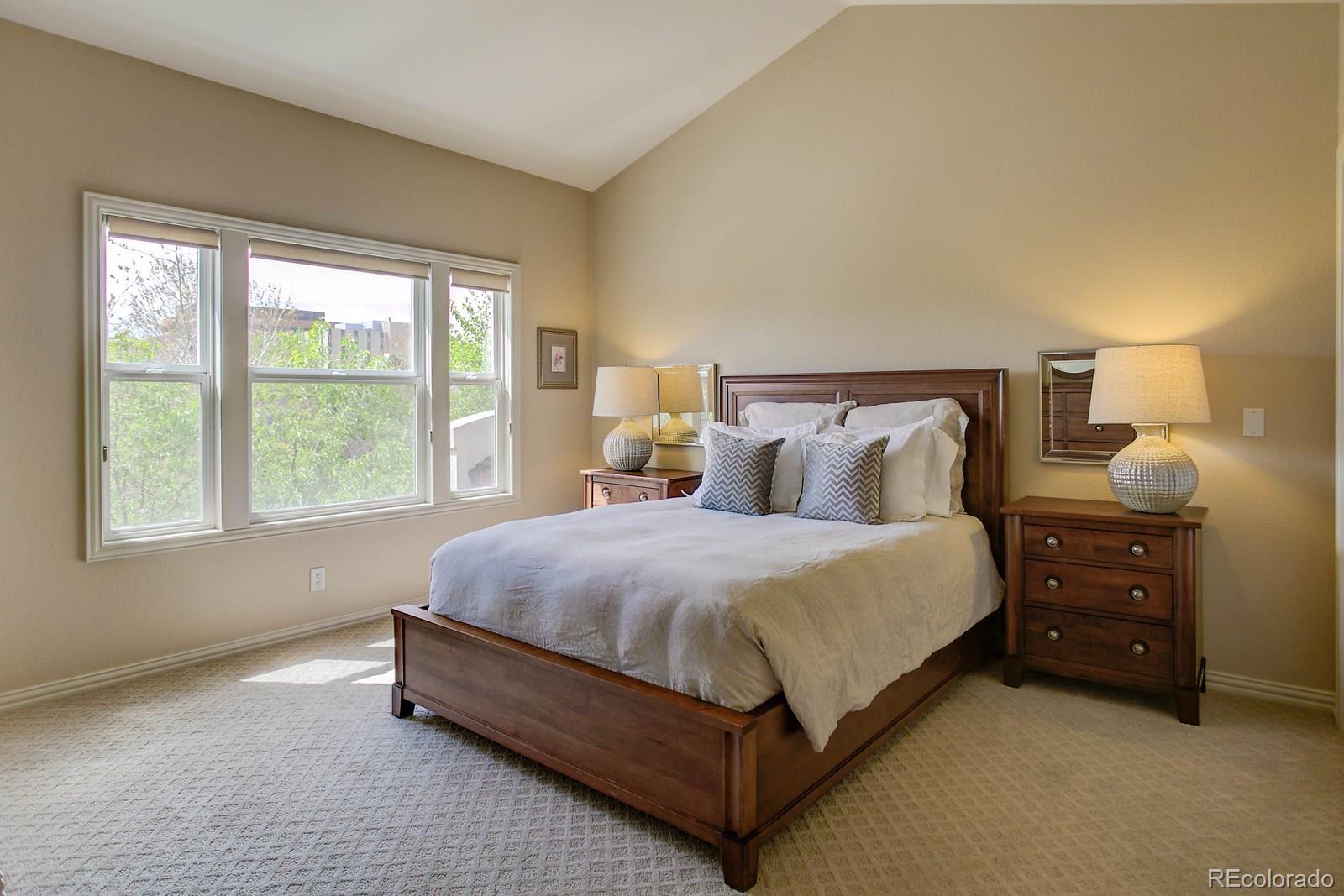 2 Garfield Street, Unit B Denver, CO 80206 - Photo 16 of 24 a spacious bedroom with a bed and window