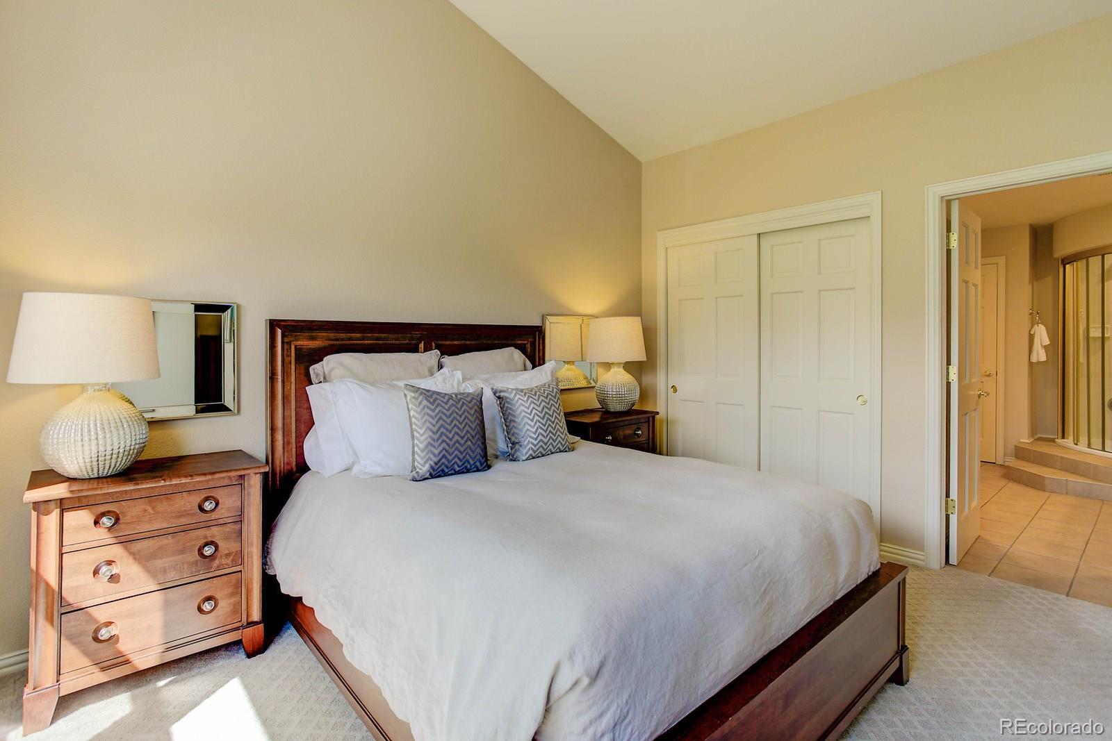 2 Garfield Street, Unit B Denver, CO 80206 - Photo 17 of 24 a bedroom with a bed and dressers