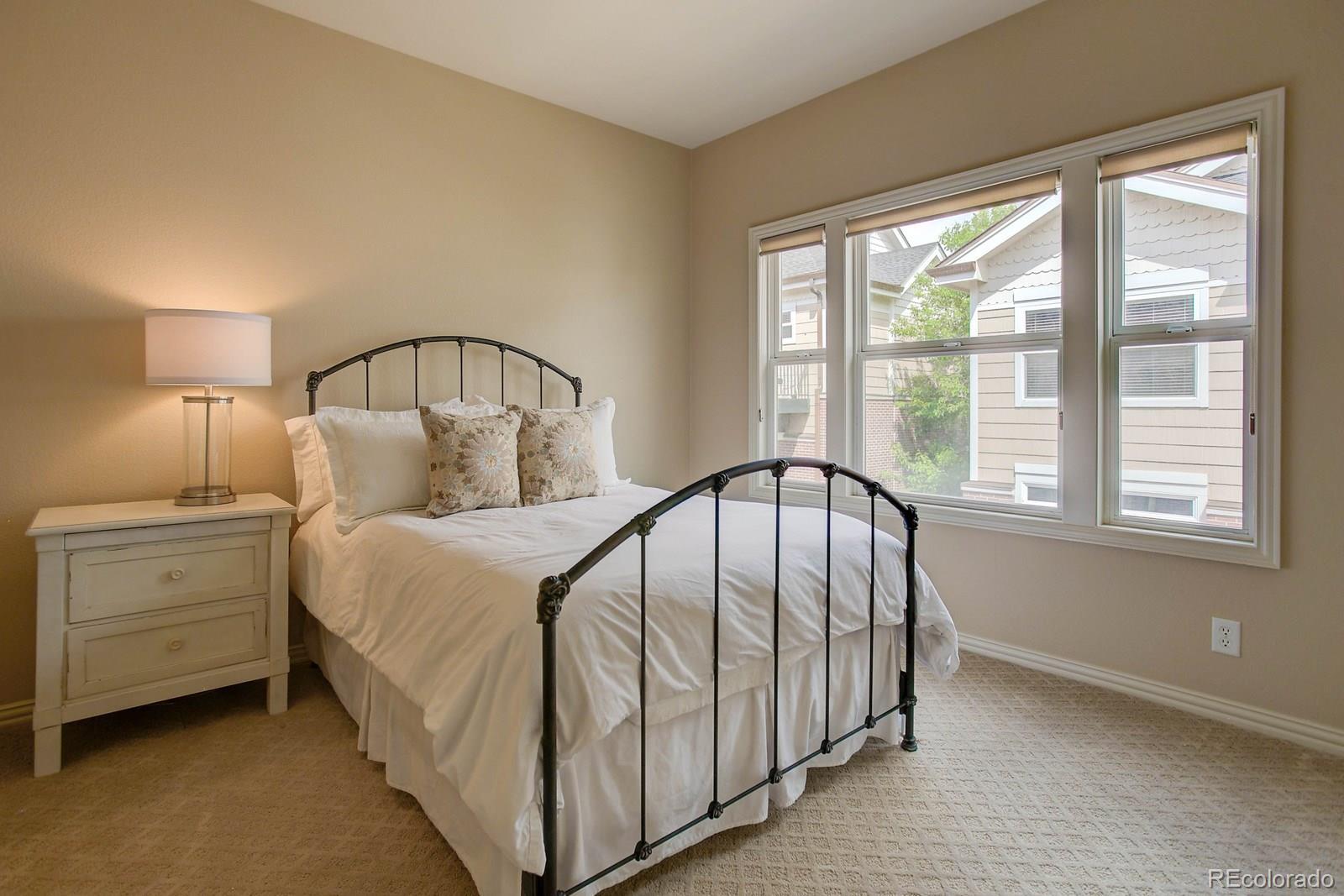 2 Garfield Street, Unit B Denver, CO 80206 - Photo 19 of 24 a bedroom with a large bed and a window