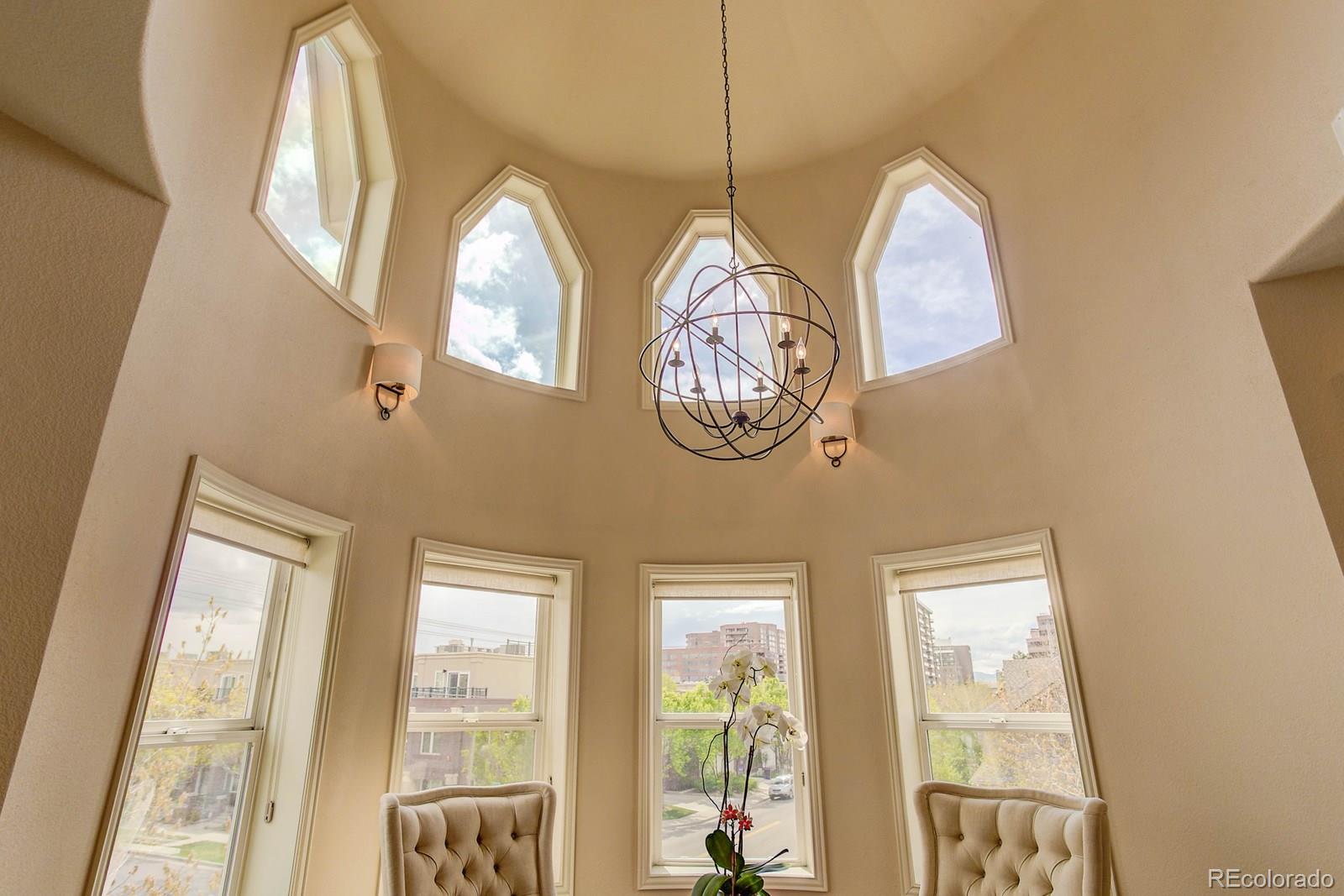 2 Garfield Street, Unit B Denver, CO 80206 - Photo 2 of 24 a view of a chandelier fan and a large window
