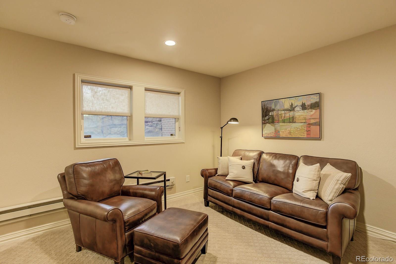 2 Garfield Street, Unit B Denver, CO 80206 - Photo 21 of 24 a living room with furniture and a window