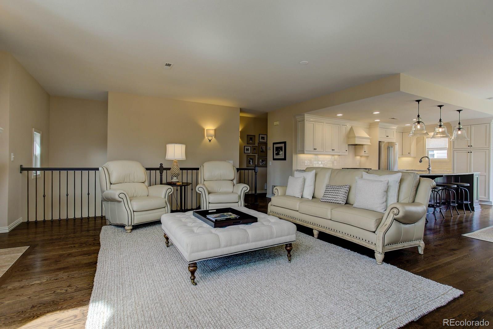 2 Garfield Street, Unit B Denver, CO 80206 - Photo 6 of 24 a living room with furniture and wooden floor