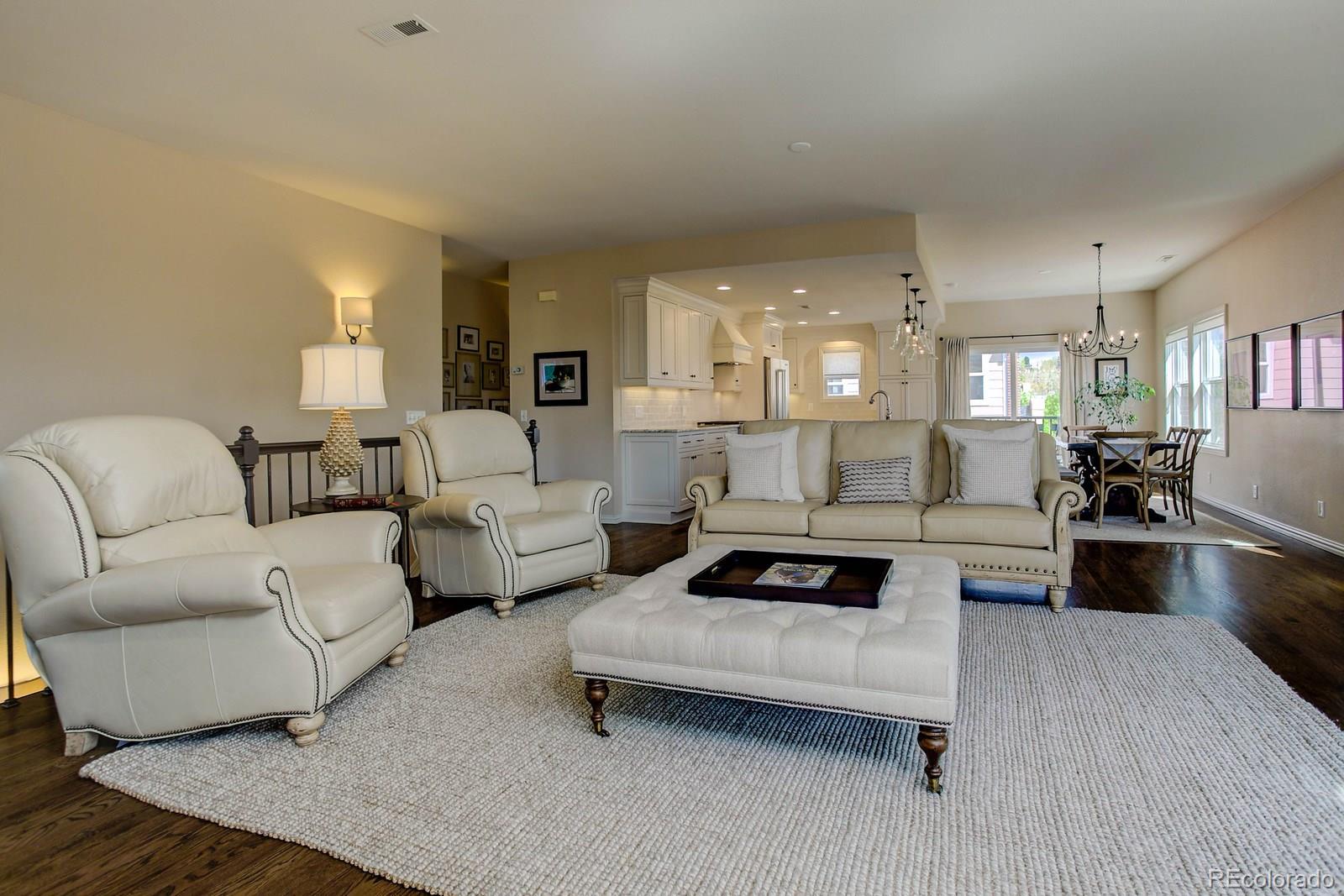 2 Garfield Street, Unit B Denver, CO 80206 - Photo 7 of 24 a living room with furniture and a wooden floor