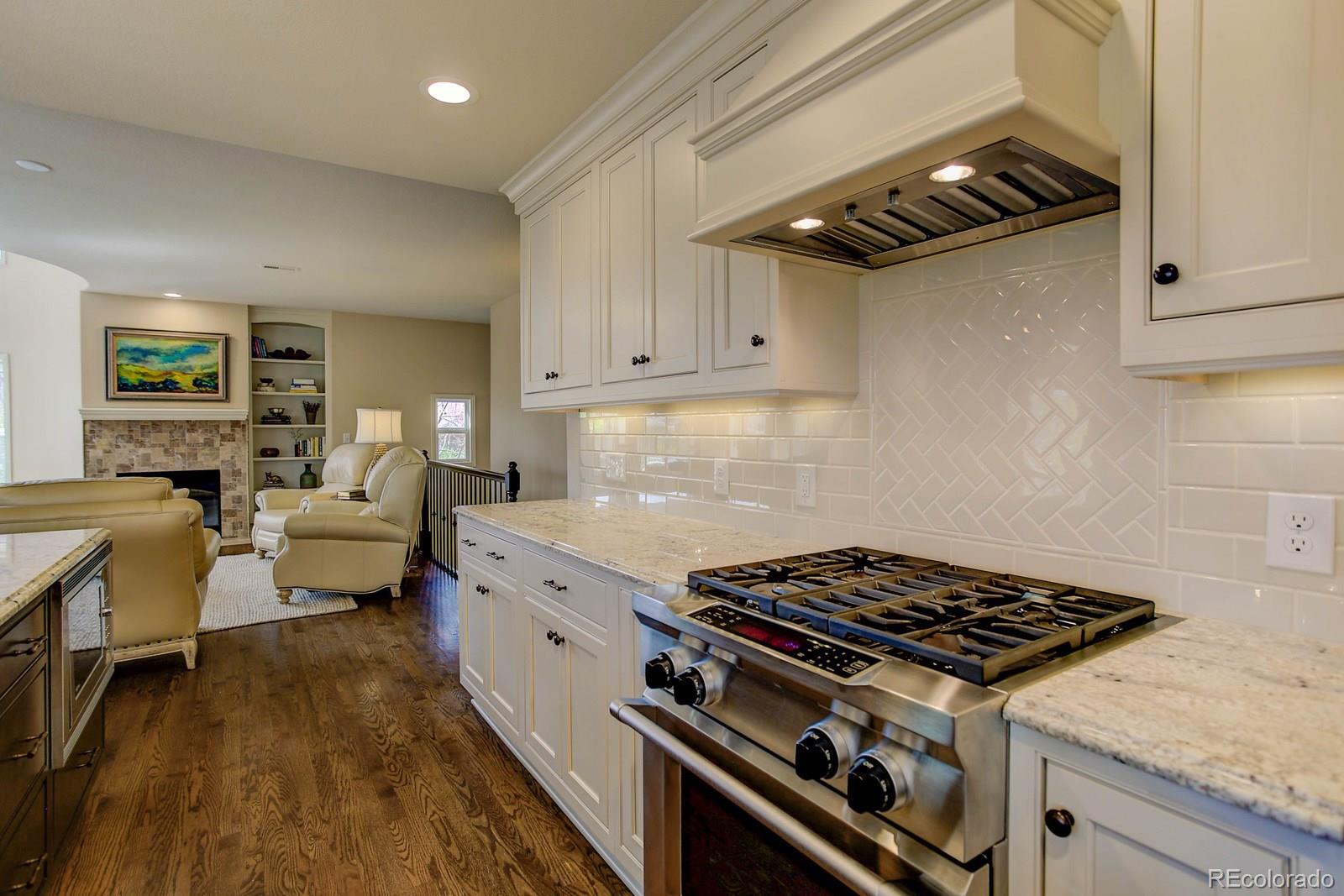 2 Garfield Street, Unit B Denver, CO 80206 - Photo 10 of 24 a stove top oven sitting inside of a kitchen
