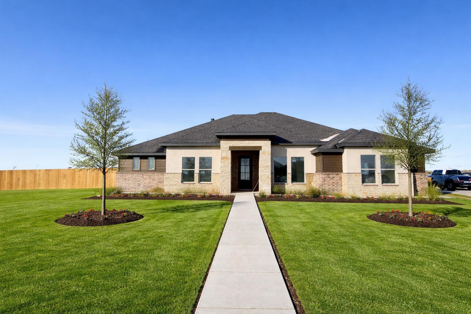 a front view of a house with a yard