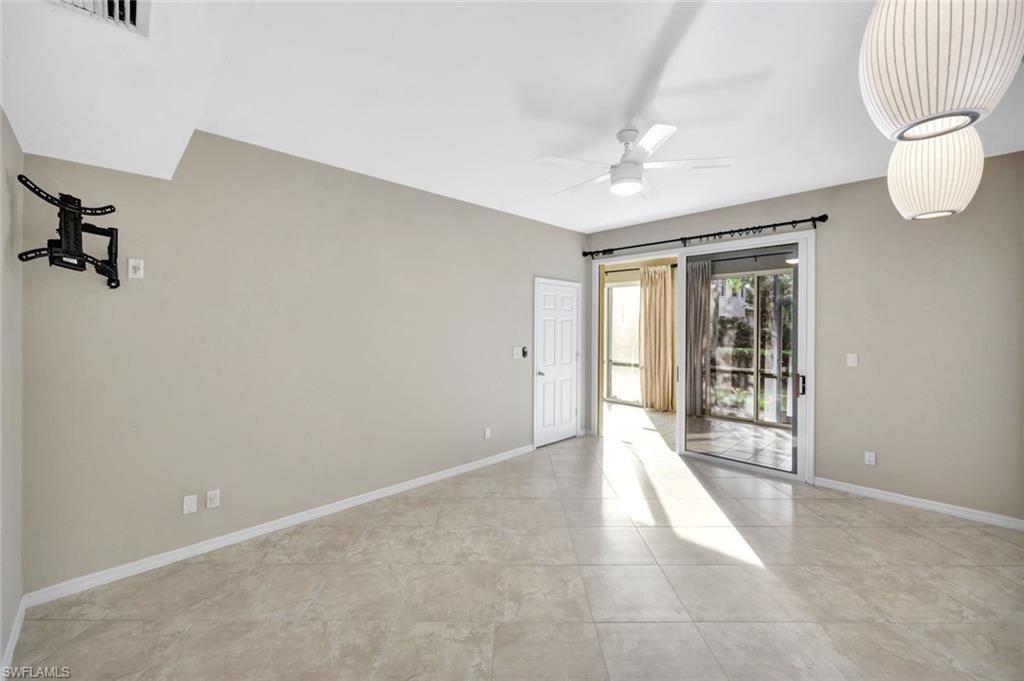 240 Via Perignon, Unit 91 Naples, FL 34119 - Photo 20 of 43 a view of an empty room with a window