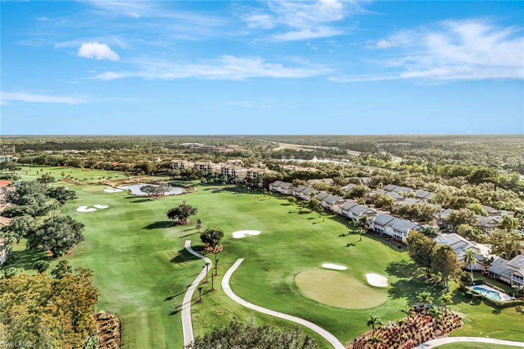 240 Via Perignon, Unit 91 Naples, FL 34119 - Photo 2 of 43 an aerial view of residential houses with outdoor space