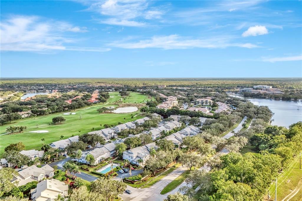 240 Via Perignon, Unit 91 Naples, FL 34119 - Photo 28 of 43 an aerial view of residential houses with outdoor space