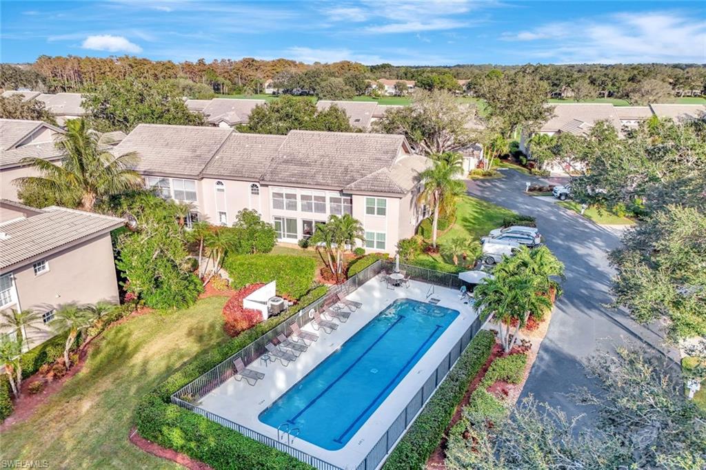 240 Via Perignon, Unit 91 Naples, FL 34119 - Photo 32 of 43 an aerial view of residential houses with outdoor space