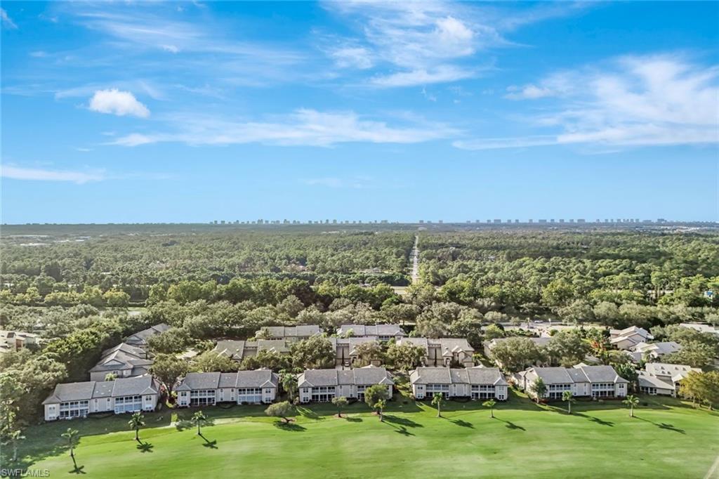 240 Via Perignon, Unit 91 Naples, FL 34119 - Photo 36 of 43 an aerial view of residential houses with outdoor space