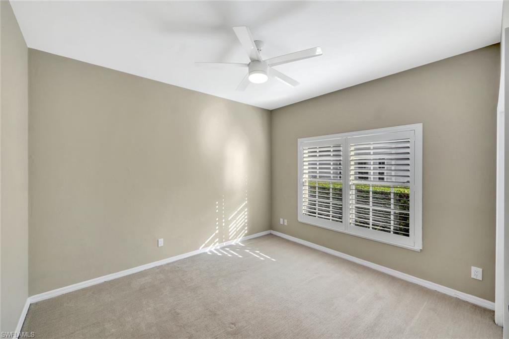 240 Via Perignon, Unit 91 Naples, FL 34119 - Photo 7 of 43 a view of an empty room with a window
