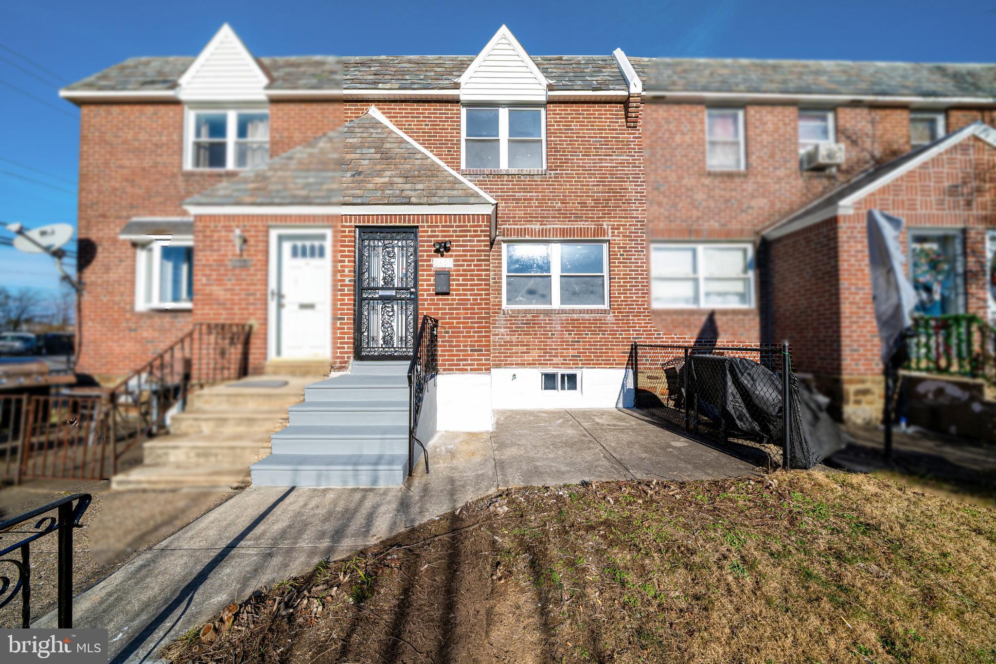 8659 Fayette Street Philadelphia, PA 19150 - Photo 2 of 47 a front view of a house with a yard