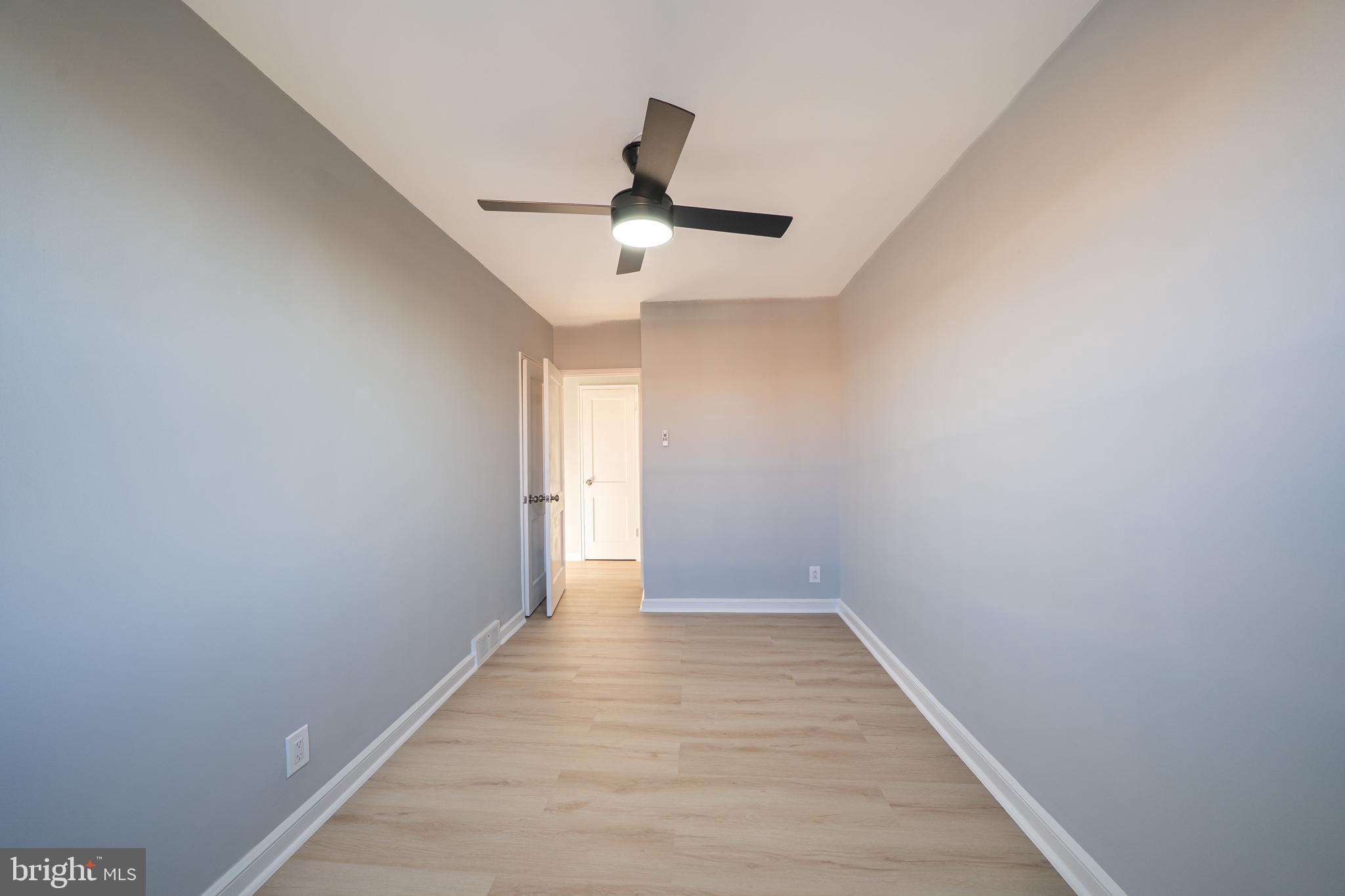 8659 Fayette Street Philadelphia, PA 19150 - Photo 29 of 47 a view of an empty room with wooden floor