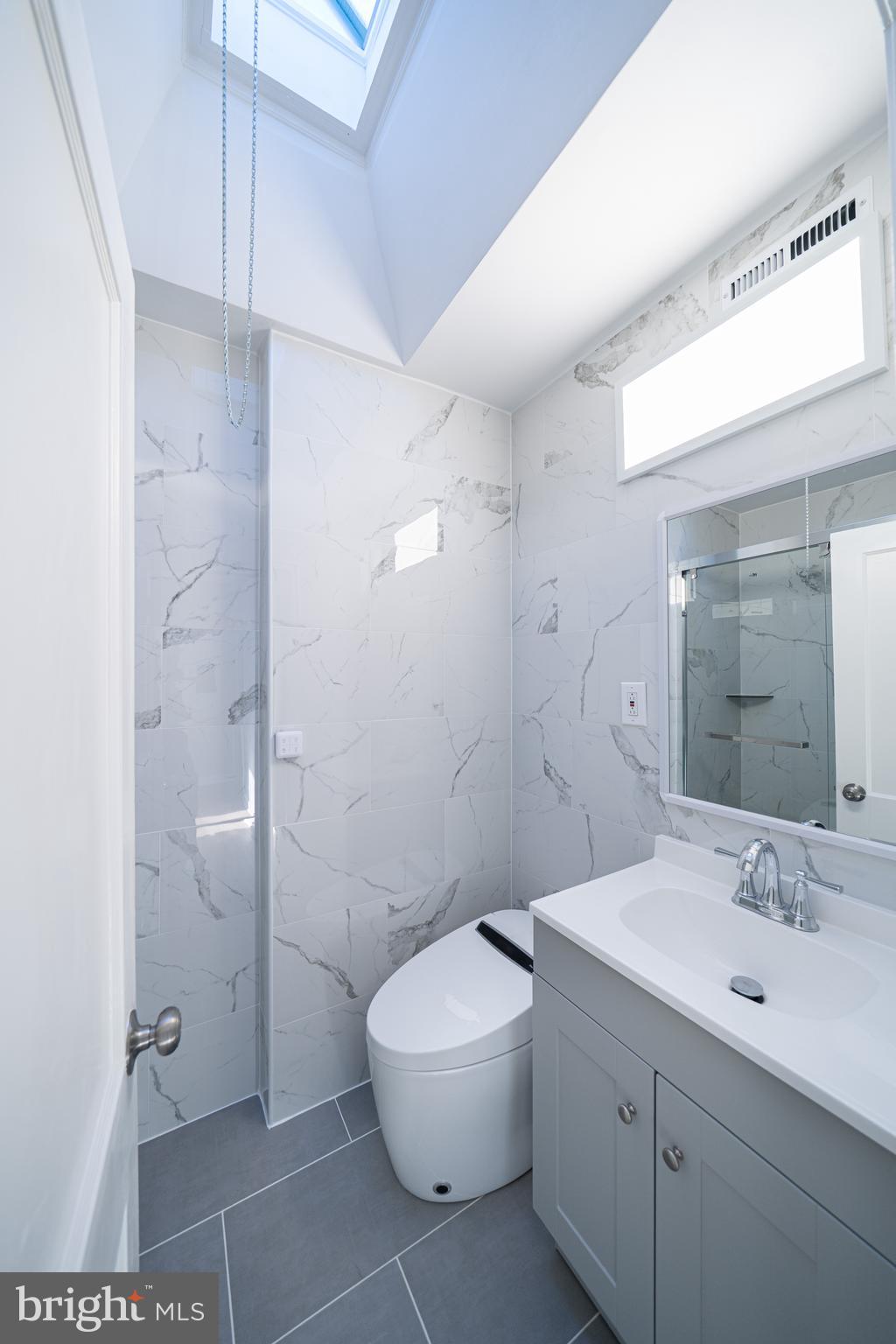 8659 Fayette Street Philadelphia, PA 19150 - Photo 30 of 47 a bathroom with a toilet sink and shower