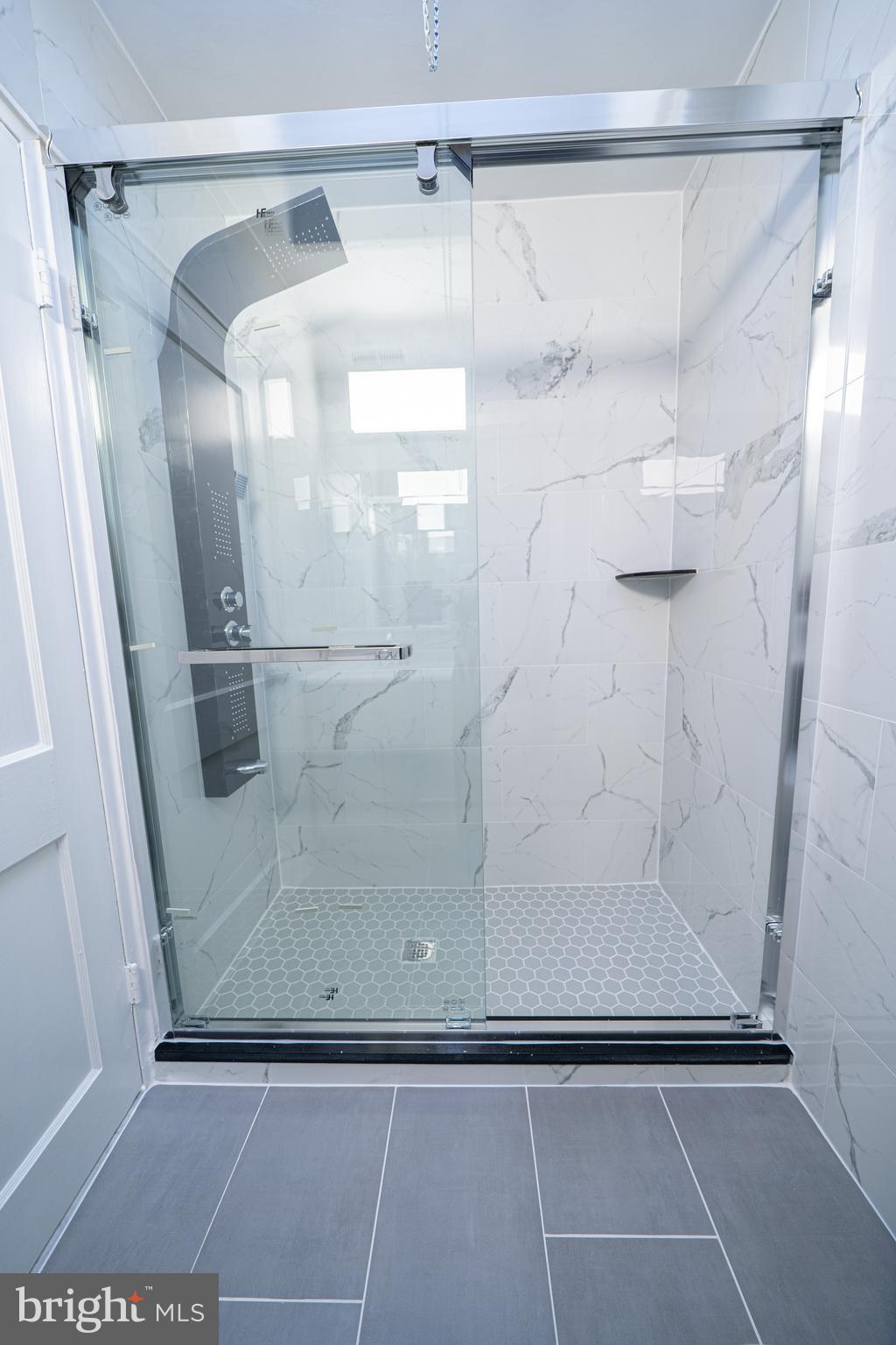 8659 Fayette Street Philadelphia, PA 19150 - Photo 32 of 47 a bathroom with a glass door shower