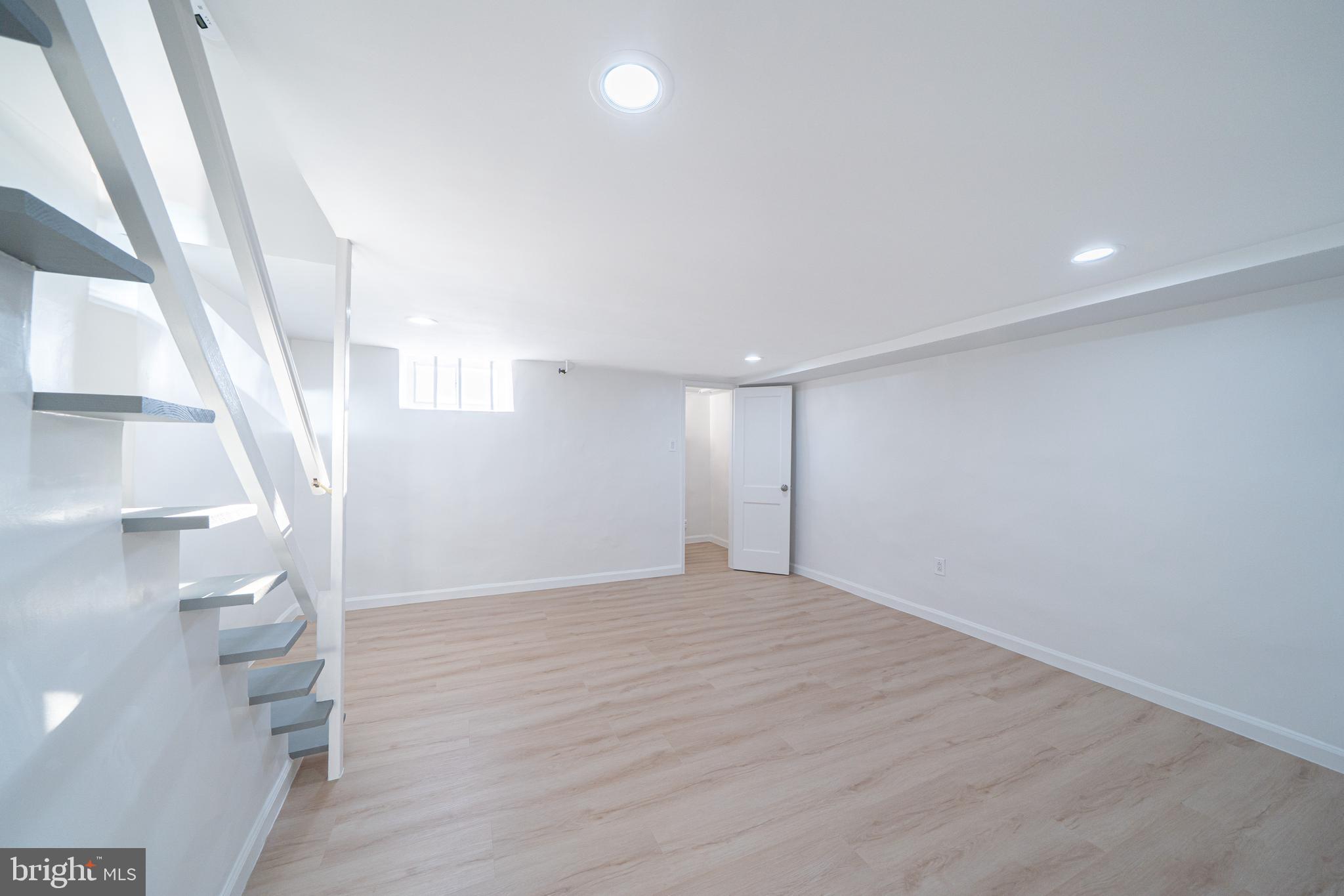 8659 Fayette Street Philadelphia, PA 19150 - Photo 37 of 47 a view of empty room with wooden floor and fan