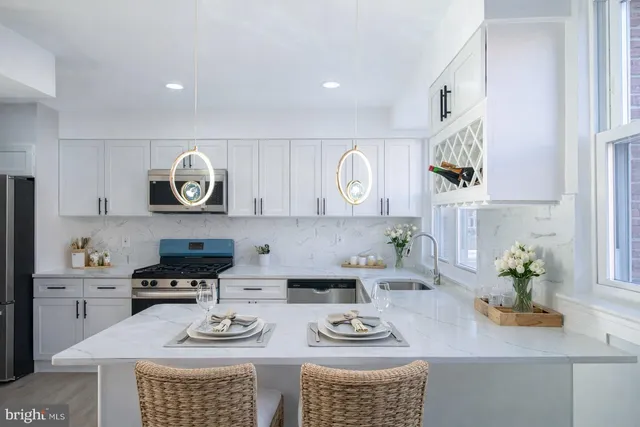 a kitchen with a wooden floor cabinets and a counter top space