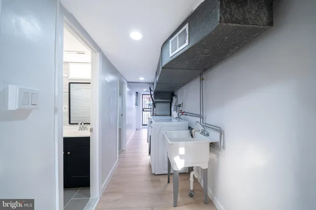 a view of a hallway with seating area