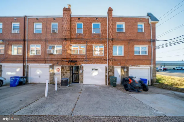 a view of a brick building with many windows