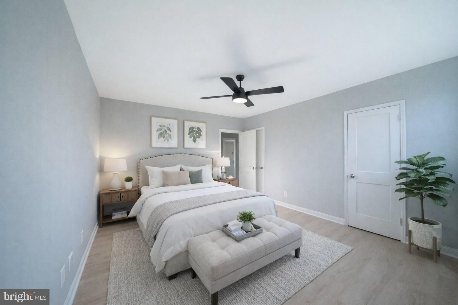 8659 Fayette Street Philadelphia, PA 19150 - Photo 7 of 47 a bedroom with a bed and a potted plant