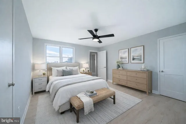 a bedroom with a bed and a dresser