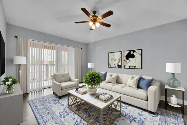 a living room with furniture and a large window