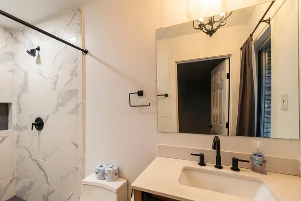 a bathroom with a sink and a mirror