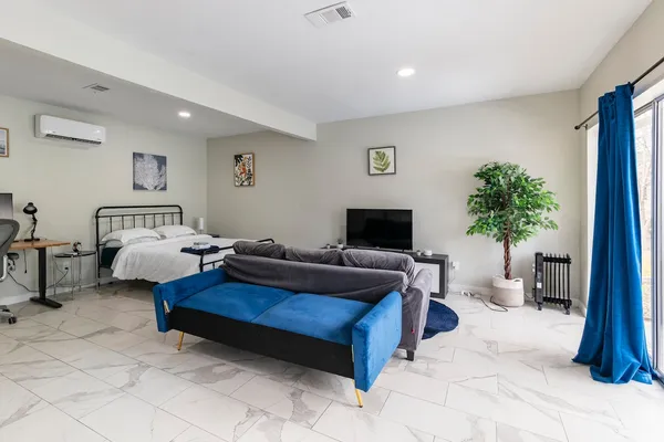 a bedroom with a bed and a cabinets