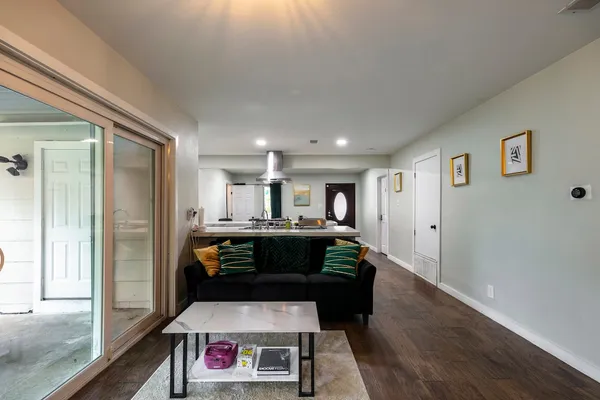 a living room with furniture and a fireplace